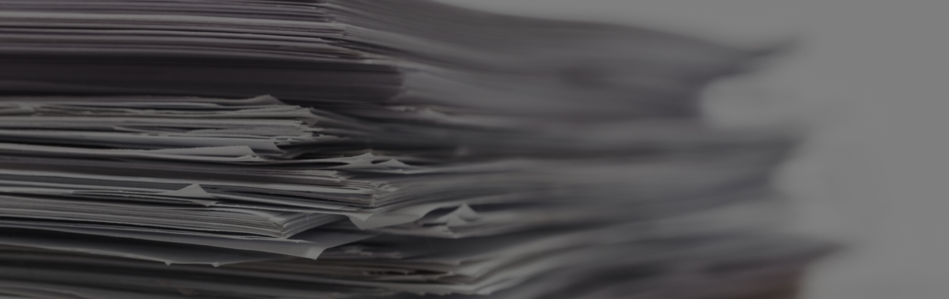 Close up photo of a stack of papers